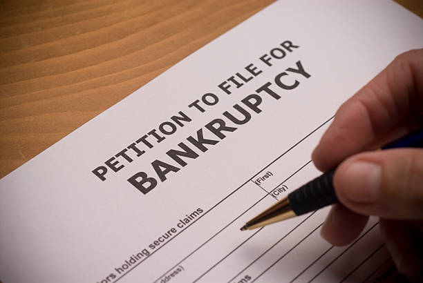 istock Bankruptcy Petition with hand and pen 471132801
