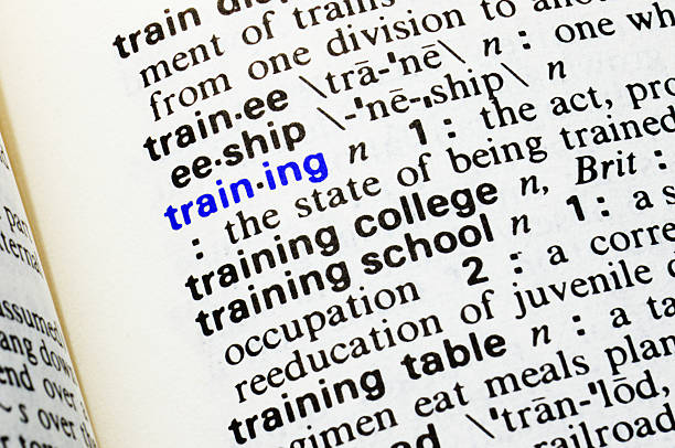 istock Training. Closeup of dictionary word entry. 471132942