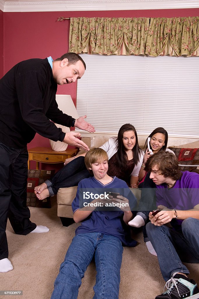 Being Ignored Kids ignoring a parent as he's trying to talk to them. All images from this series: Father Stock Photo