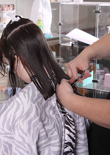 Step-by-Step Guide: Applying Pre Bonded Remy Hair Extensions at Home 5 Haircut Little girl getting her hair cut at a salon Repeat the Process hair extensions stock pictures, royalty-free photos & images