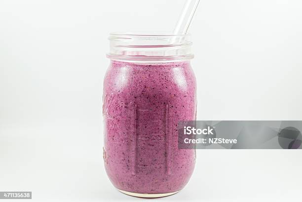 Blueberry Raspberry Strawberry And Banana Smoothie Stock Photo - Download Image Now