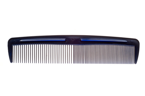 A blue  plastic comb isolated on white
