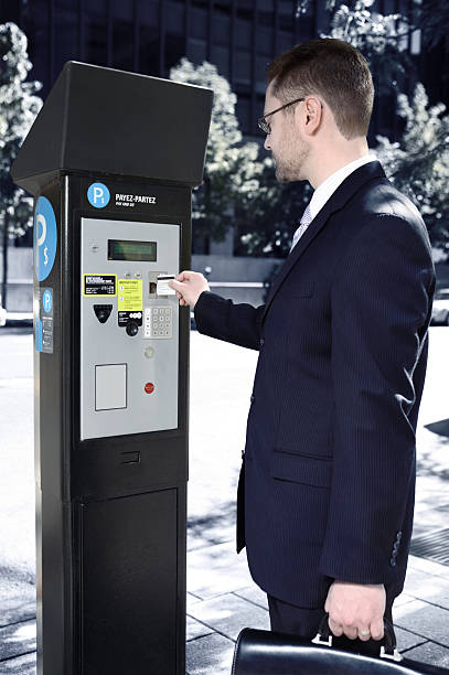 istock Business man and parking meter. 471136779