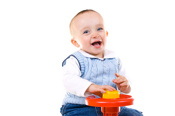 istock Smiling child on toy 471137591