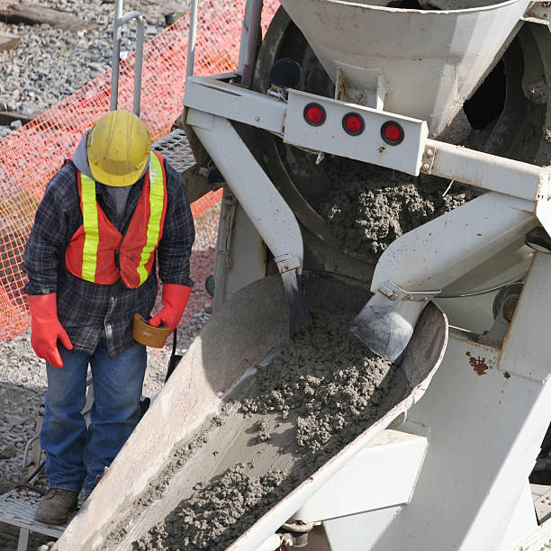 istock Construction Industry, Cement Truck Pouring Concrete At Construction Site 471137669