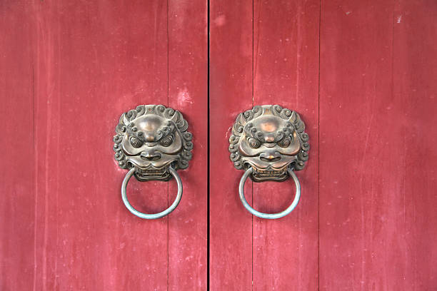 istock Asian Lion Door Knocker with Red Background 471137817