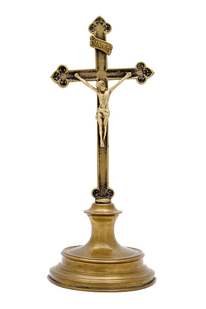 istock Standing old brass crucifix isolated on white 471138329