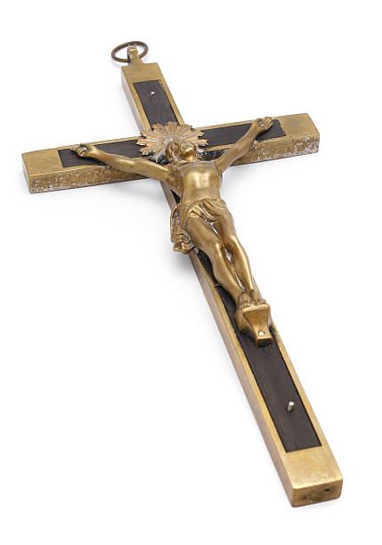 istock Laying down old brass crucifix isolated on white 471138337