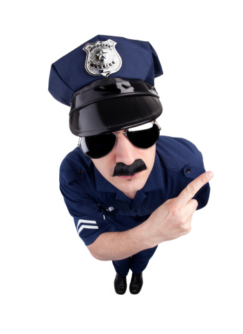 A dog policeman with a gun is arresting a criminal. White background. Isolated.