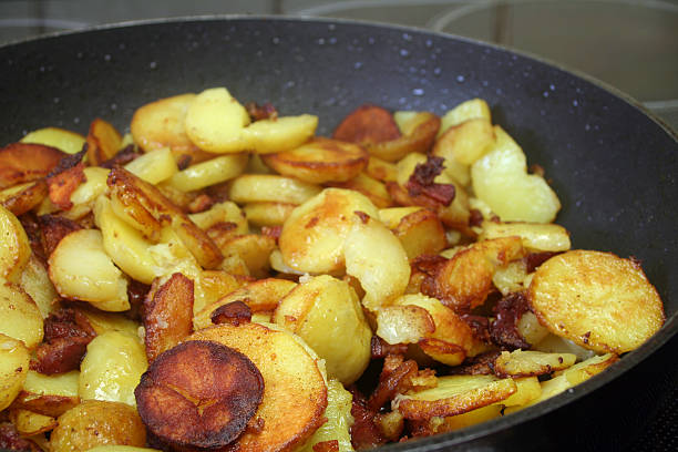 Roast Potatoes closeup of roast Potatoes, shallow dof, focus on foreground fried potato stock pictures, royalty-free photos & images