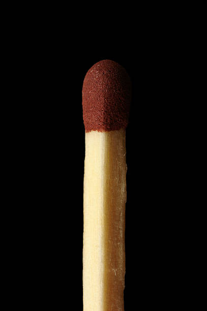Unlit Matchstick Close up of an unlit matchstick with a black background. unlit match stock pictures, royalty-free photos & images