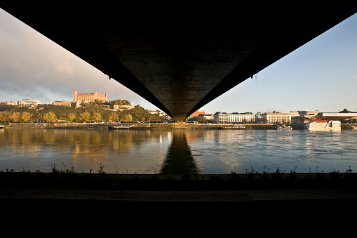 view of the bratislava skyline from under the bridge