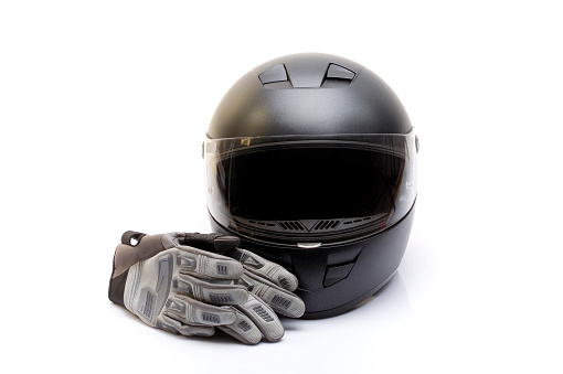 Motorcycle boots and gloves on white background