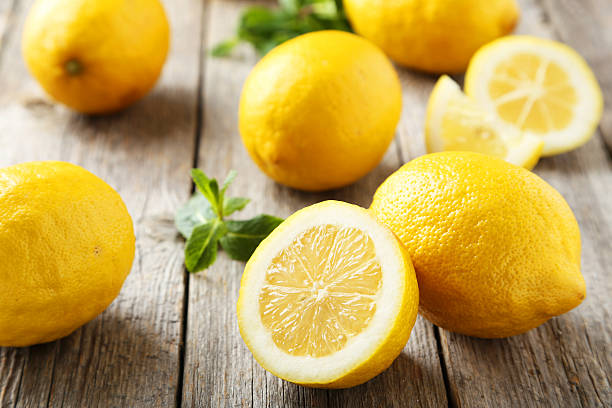 Lemons on grey wooden background