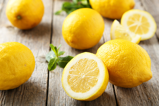 Lemons on grey wooden background