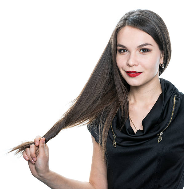 istock girl holding her hair 471141490
