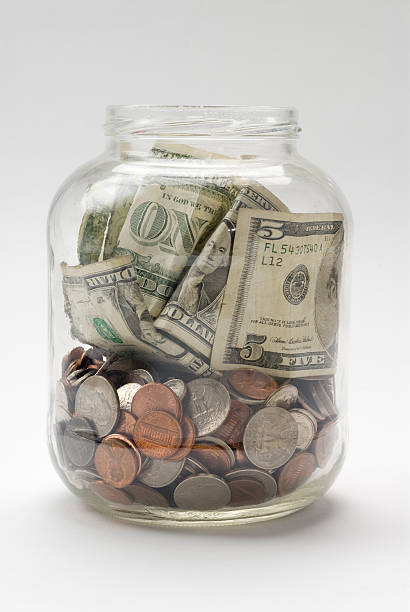 istock Money Jar with currency 471141729