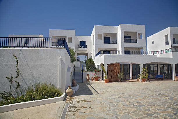 istock White Greek Buildings against Blue Sky 471141941