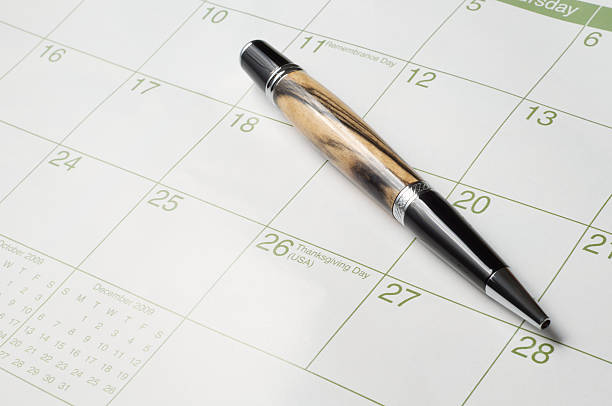 Wooden Pen on Calendar