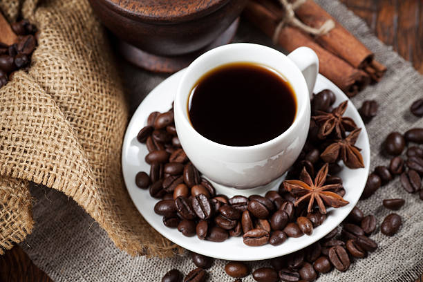istock Cup of coffee with beans and spicery 471144534