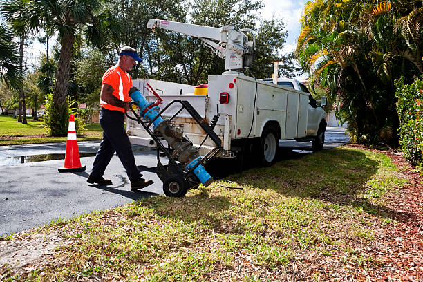 istock Water Department Technician Moving Large Pump 471144573