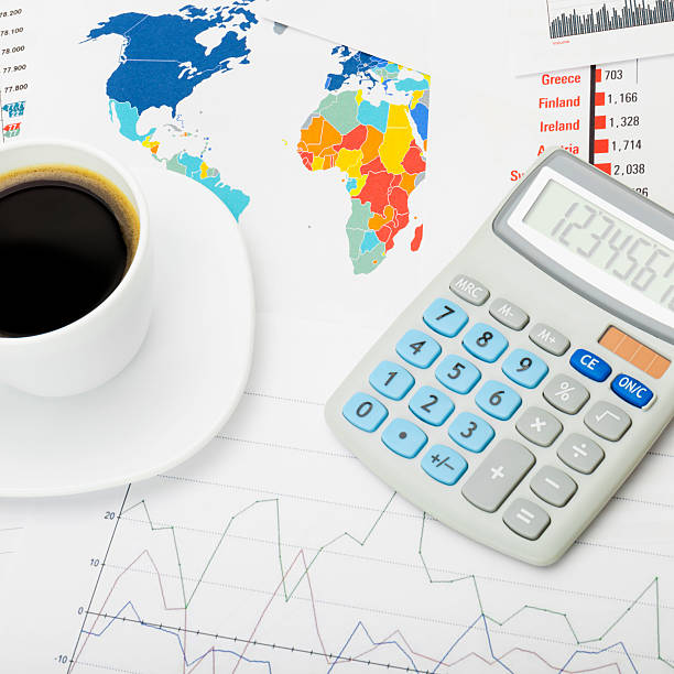 istock Coffee cup and calculator - close up shot 471144766