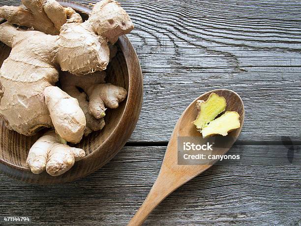 Overhead Shot Of Ginger On Dark Wooden Background Stock Photo - Download Image Now - Ginger - Spice, Table, 2015