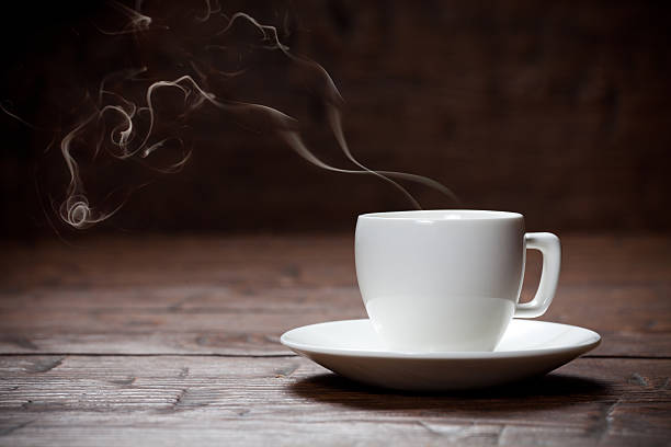 istock Coffee cup and saucer on old wooden table. 471145082