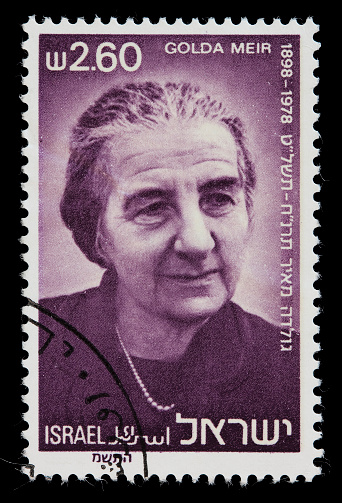 An Israeli postage stamp memorializing the life of Golda Meir, the first female Prime Minister of Israel. Note: Deep purple ink shows some blotchiness at 100%. DSLR with macro lens; no sharpening.