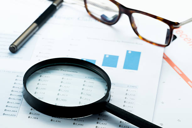 istock Document financial with magnifying glass.searching profit 471145322