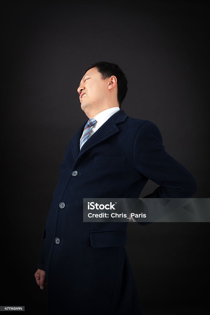 handsome man doing different expressions in different sets of clothes handsome man doing different expressions in different sets of clothes: backache 2015 Stock Photo