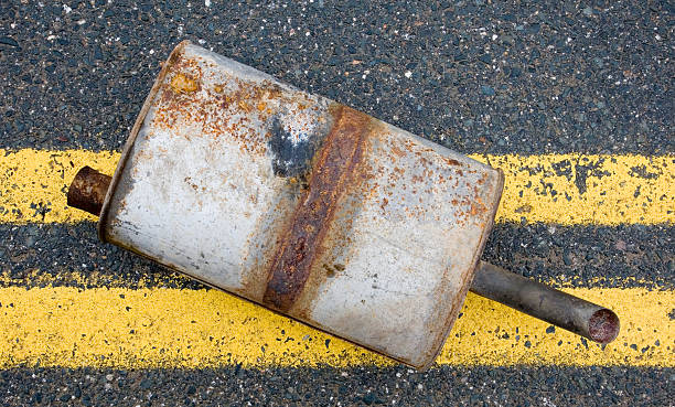istock Old muffler in the road 471145807