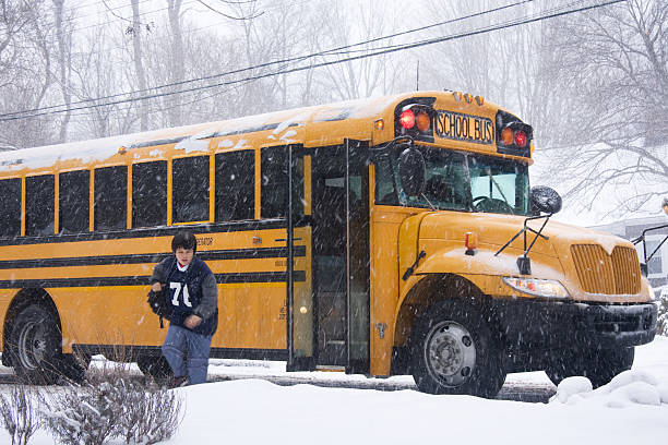 istock boy being dropped off by school bus 471147047