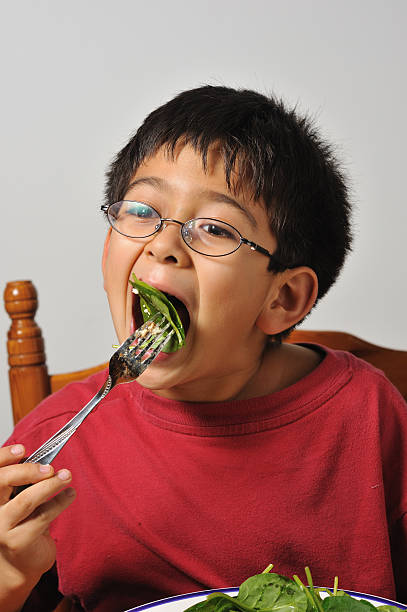 istock Young boy eating healthy 471147279