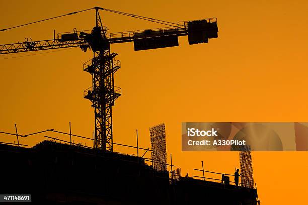 Sunset Construction Stock Photo - Download Image Now - Architecture, Back Lit, Blue-collar Worker