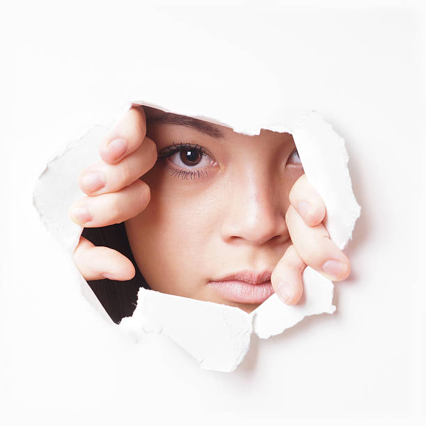 istock young asian woman peeking 471149968