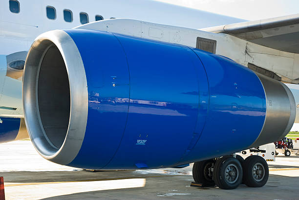 istock Large blue jet engine on wheels in airport 471150073