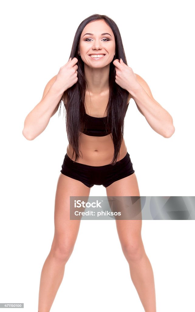 Bellissima giovane donna esercizio nel centro fitness - Foto stock royalty-free di 2015