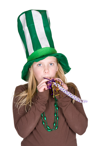 A girl wearing St. Patrick's Day decorations.