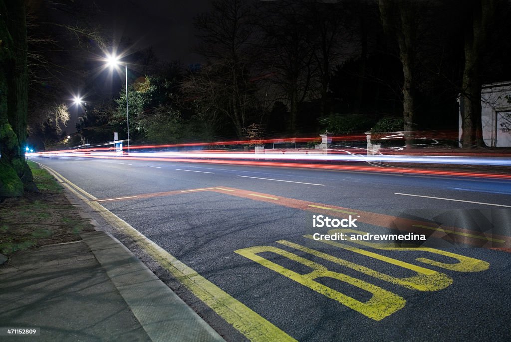 Bus Stop at Night /Light Trails-See lightbox below for more A modern street scene at night. Night Stock Photo