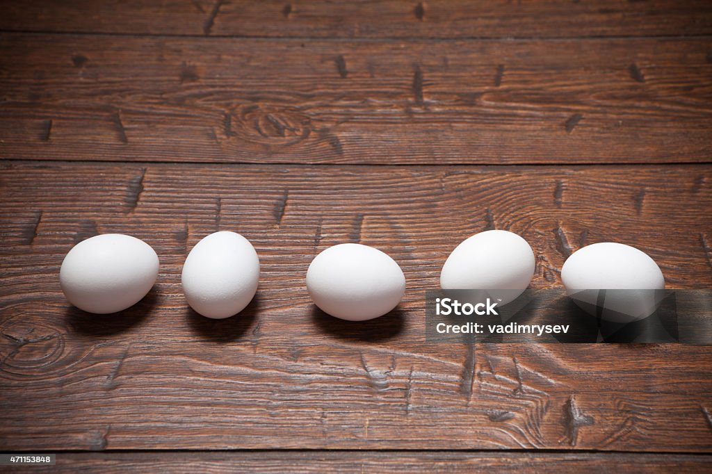 Eggs on a wooden rustic table Fresh farm eggs on a wooden rustic table 2015 Stock Photo
