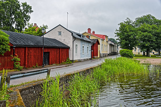 istock Old wooden houses on waterfront 471154820