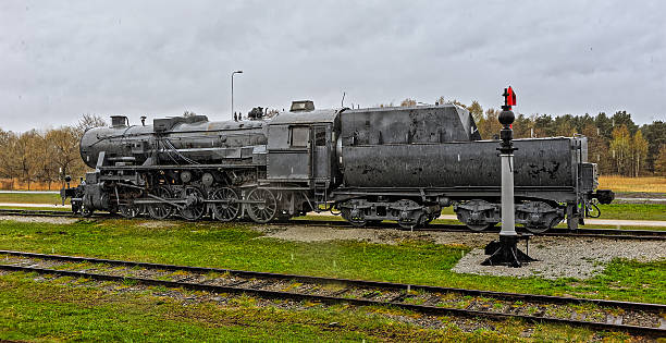 Old steam locomotive under heavy rain. Haapsalu, Estonia