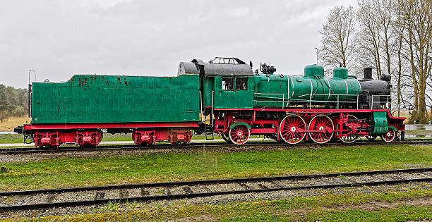 Old steam locomotive under heavy rain. Haapsalu, Estonia