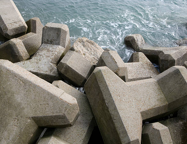 A pile of concrete sea defense blocks photographed on the south coast of England.