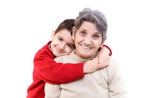 Grandmother and grandson hugging 