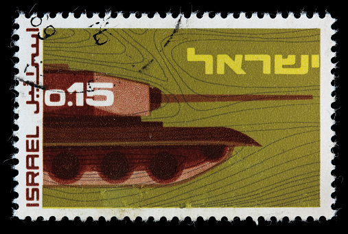 1969 Israeli postage stamp depicting a tank with a gun turret. DSLR with macro lens; no sharpening.