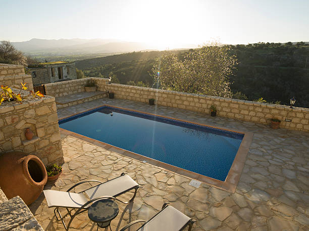 istock Sunrise over distant hills and swimming pool 471155620