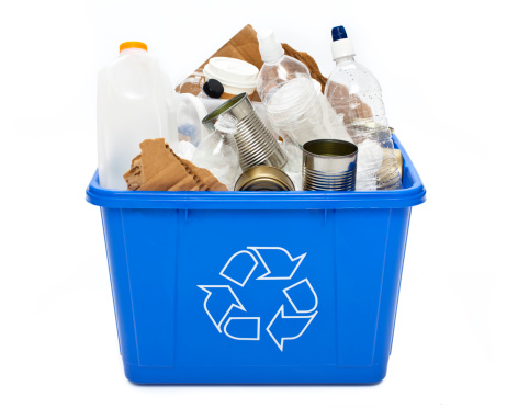 A full recycle bin isolated on a white background.