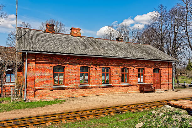 istock Old red brick railway station building 471155854